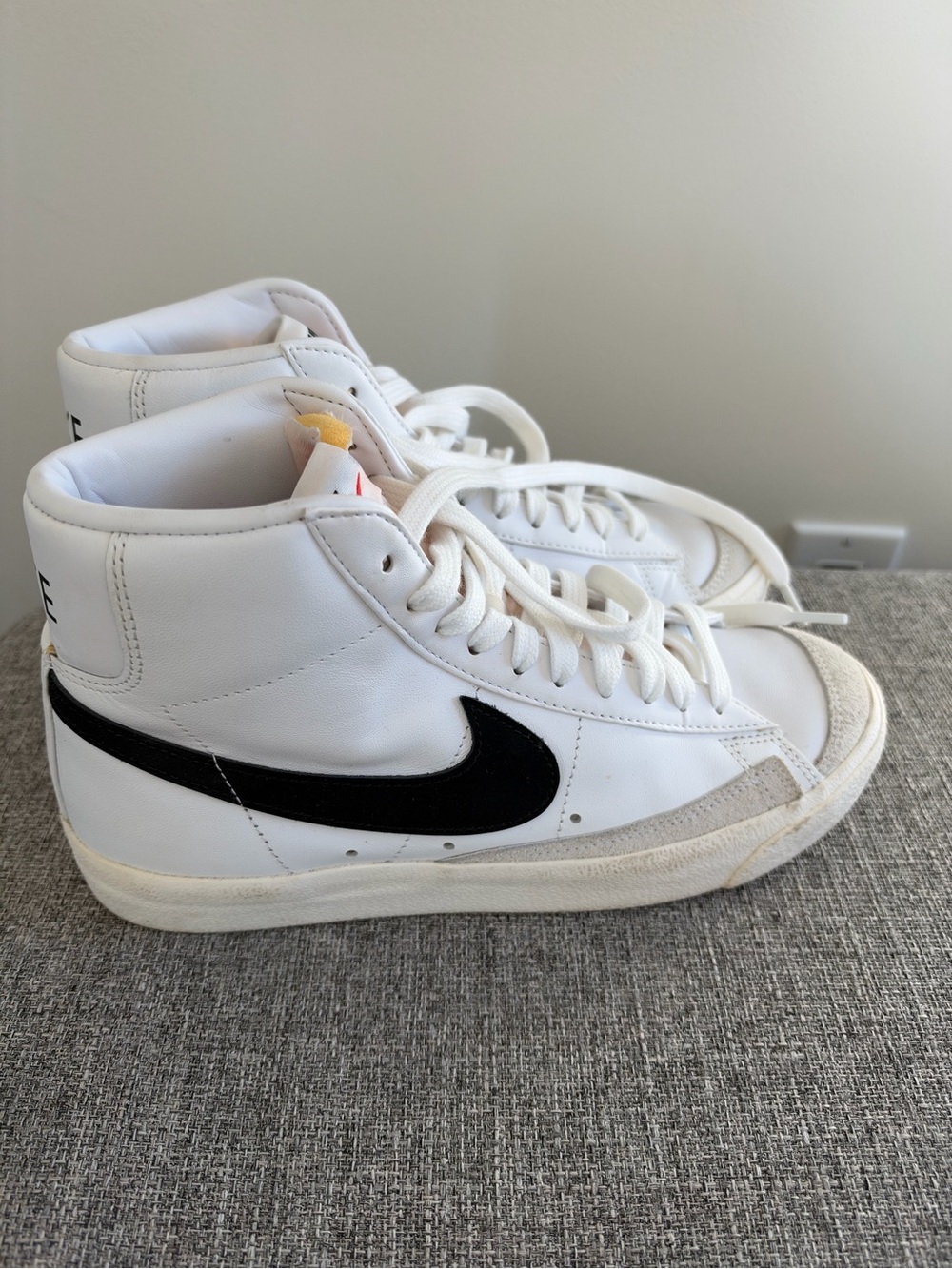 Nike White High-Top Sneakers with Black Swoosh